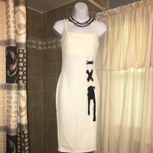 White dress with black ribbon